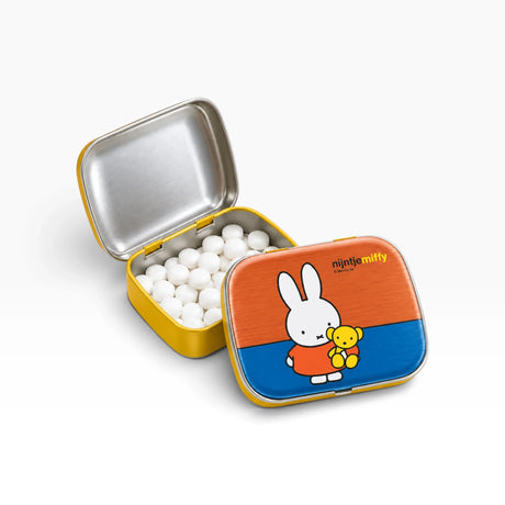 Miffy pill tin with Teddy graphic, open lid showing white pill tablets inside