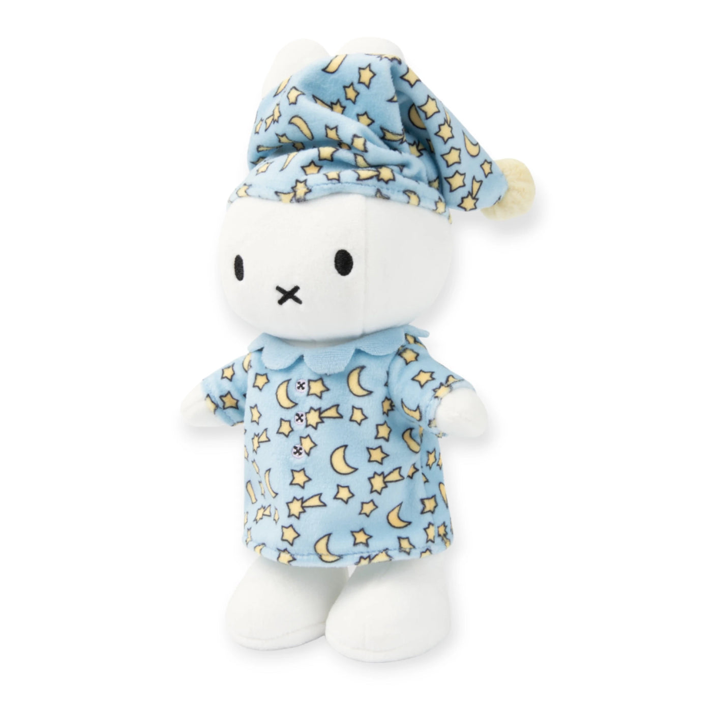 The Miffy Bunny Pyjama Plush - 24cm by Miffy is an eco-friendly plush toy featuring a white rabbit dressed in blue pajamas and a matching sleep cap with star and moon patterns, making it ideal for cozy sleepovers.