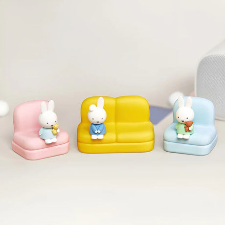 Set of Miffy sofa phone stands with bunny figures on pink, yellow, and light blue seats