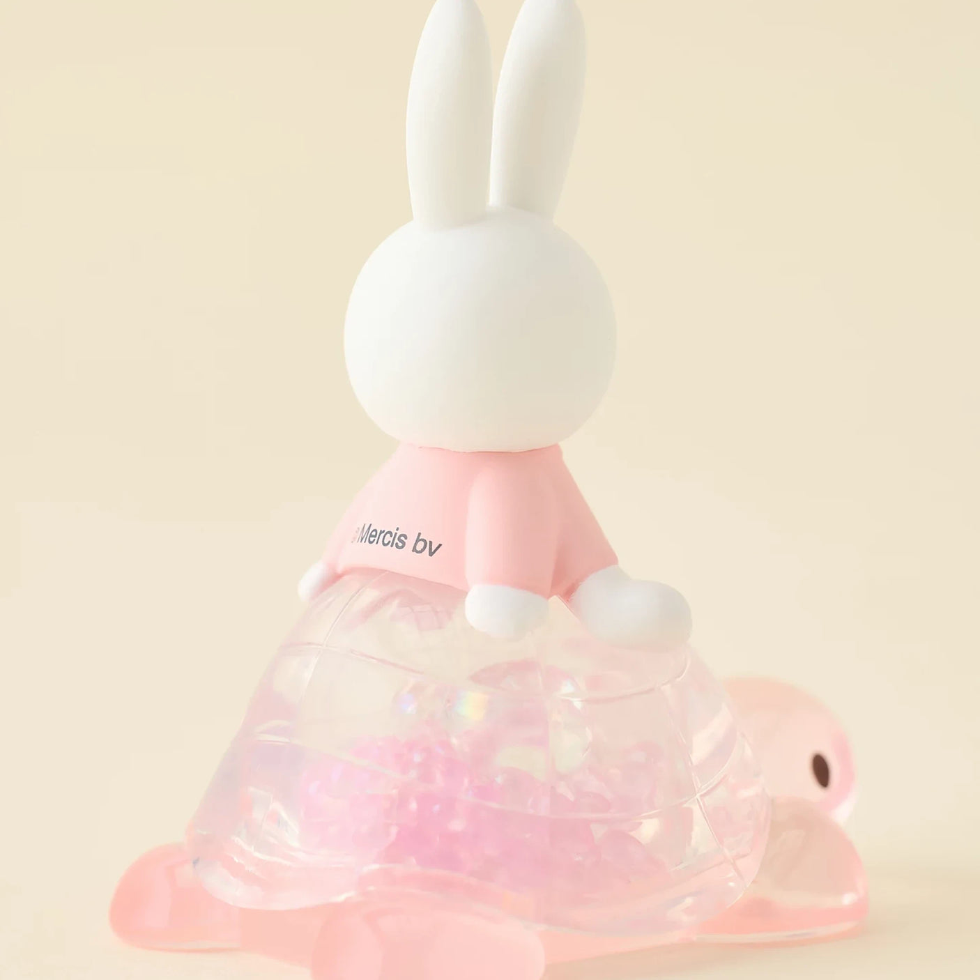 Rabbit blind box figure side view, pink top and translucent layered cone skirt