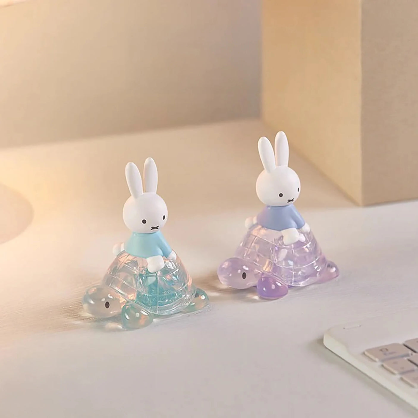 Rabbit blind box figures in blue and purple translucent cone outfits