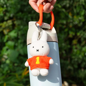 White plush bunny keychain with orange shirt marked '1' and metal clasp