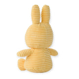 The Miffy Bunny Plush Corduroy in Buttercream, made from recycled polyester, is depicted with its ears pointing up and facing away.