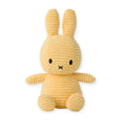 A Miffy Bunny Plush Corduroy in Buttercream, measuring 23 cm, featuring a ribbed texture with long ears and a small black face, is shown sitting upright against a white background and providing hypoallergenic comfort.