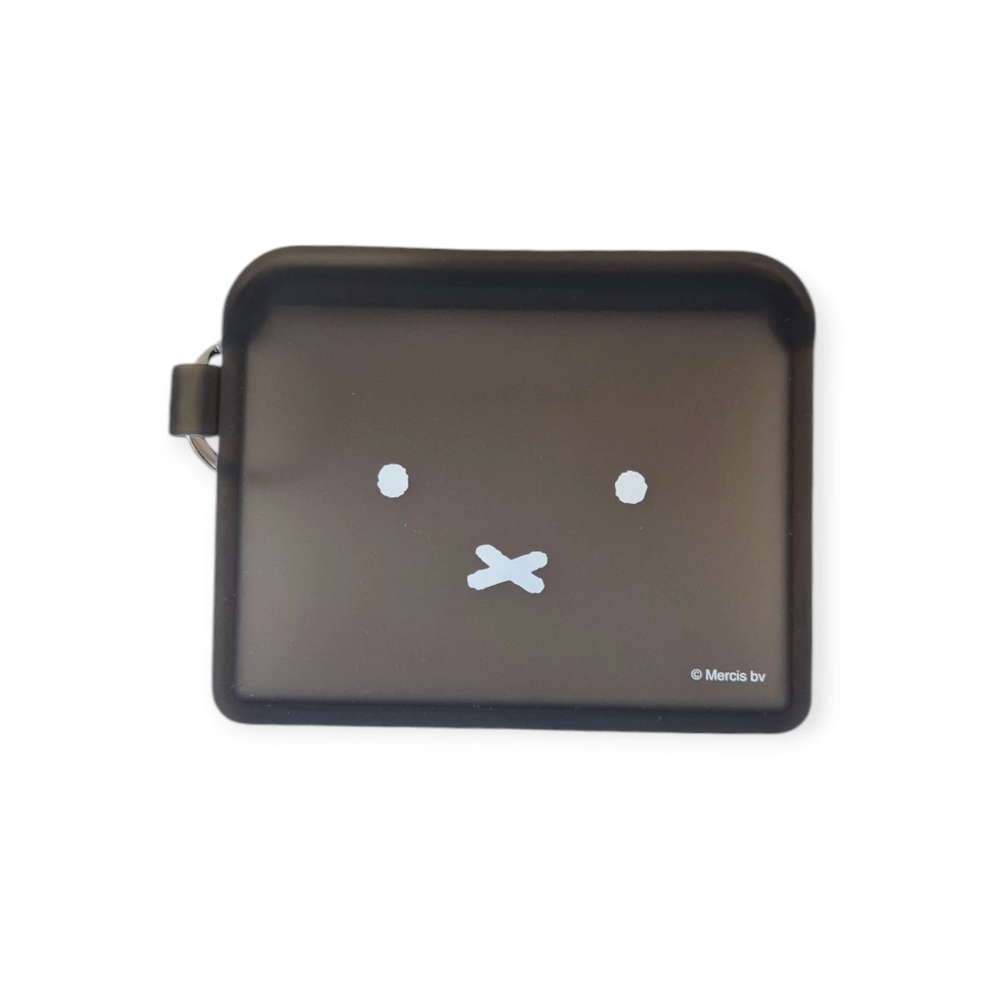 The Miffy Bunny Card Case - Black, by Miffy, is a black rectangular coin purse crafted from durable silicone, featuring a minimalist face design with two white dot eyes and a cross-shaped mouth.