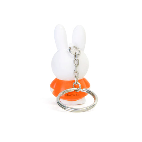 Charming Miffy Keychain - Classic, featuring an adorable white rabbit dressed in a vibrant orange outfit reminiscent of iconic colors, shown from the back. This delightful accessory adds charm to any collection, making it perfect for fans and collectors of the Miffy brand.