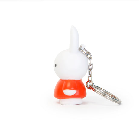 The Miffy Keychain - Classic by the brand Miffy showcases a white rabbit wearing a timeless red outfit, facing left against a white background, making it an adorable addition to any collection.