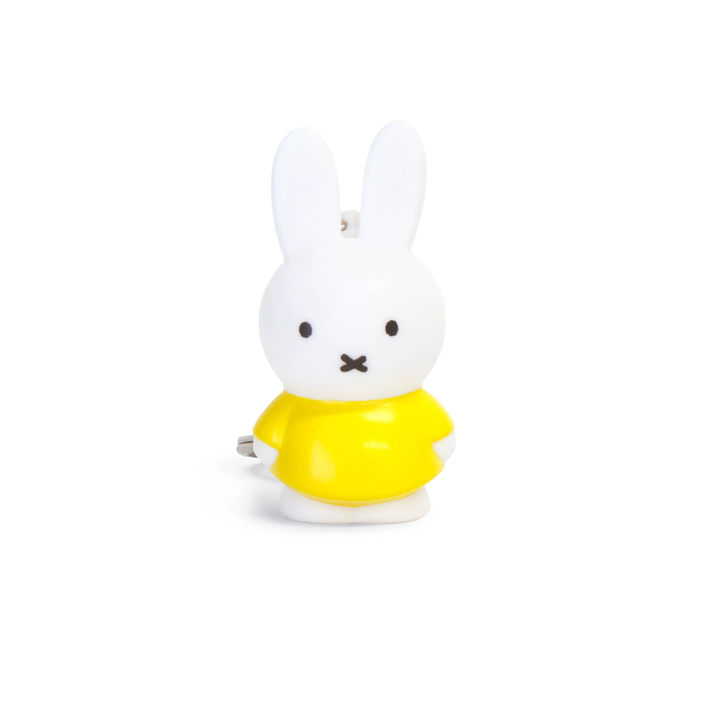 The Miffy Keychain - Classic features a white bunny figurine wearing a yellow shirt, showcasing the charm of timeless colors against a plain white backdrop.