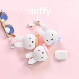 Miffy bunny coin pouch keychains, white plush bunnies with key rings and pastel accents.