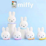 Miffy bunny coin pouch keychains, white plush bunnies with key rings and light pastel bases.