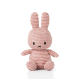 The Miffy Bunny Plush Corduroy - Pink 23cm by Miffy features a charming ribbed texture and sits upright against a white background, providing baby-safe comfort and appeal.