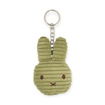 The Miffy Plush Flat Keychain - Corduroy is an eco-friendly, green bunny-shaped keychain designed with ribbed corduroy and features a metal ring and chain.