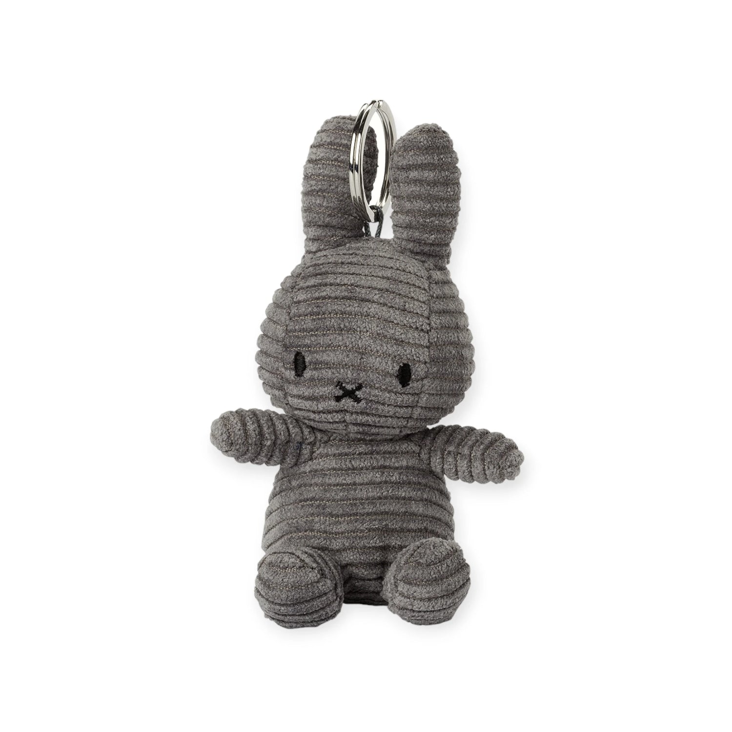 The eco-friendly Miffy Keychain Corduroy 10cm from Miffy showcases a grey fabric bunny with black stitched eyes and mouth, detailed with horizontal corduroy lines, and comes with an attached metal ring.