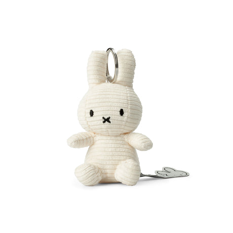 This eco-friendly Miffy Keychain Corduroy features a minimalist off-white bunny with long ears, small black nose, and eyes, enhancing its charm.