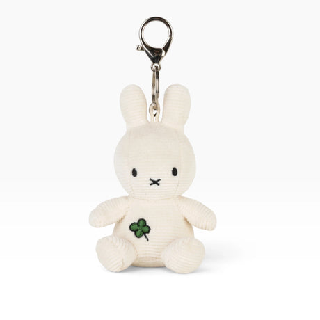 Cream plush bunny keychain with metal loop, black eyes and green clover
