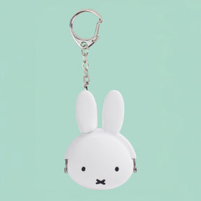 White Miffy head keychain coin pouch with silver clasp and chain on light green background, gallery position one