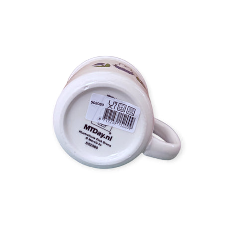 White ceramic Miffy Ceramic Mug - Blue Tulip, by Miffy, shown upside down with a barcode sticker and the printed text “MTDay.nl” and “502080” visible on the bottom.