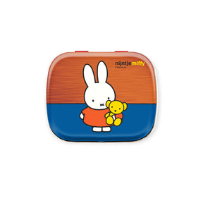 Rectangular lunchbox featuring Miffy character holding a yellow teddy bear against orange and blue background