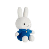 Meet the Miffy Plush Classic Blue - a cuddly 20cm companion from the Miffy brand. This charming white rabbit with long ears is dressed in a Classic Blue outfit and sits upright on a plain background, ready to capture hearts with its timeless charm.