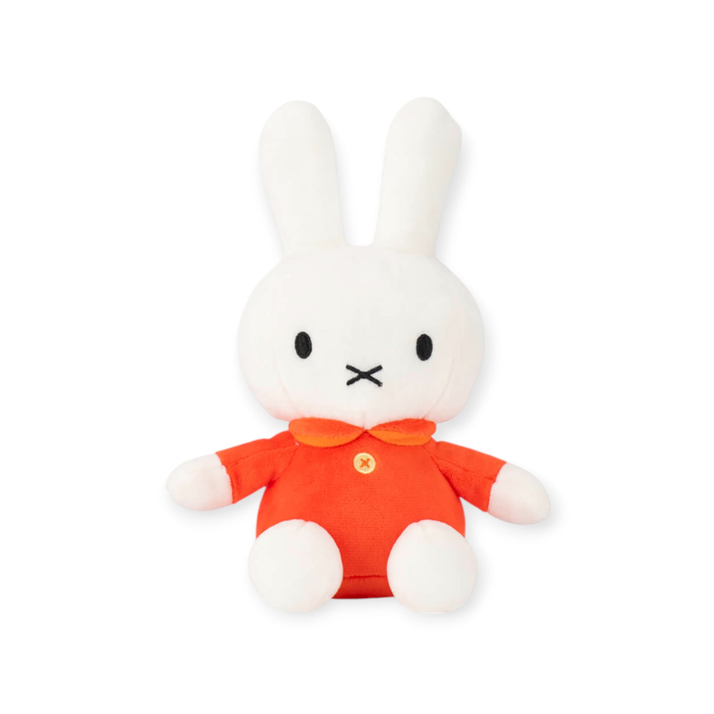 A soft and cuddly white plush bunny with long ears, dressed in a classic red outfit featuring a collar and button, this adorable Miffy Plush Classic Red - 20cm gently leans against a plain backdrop.