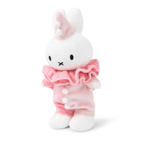 Introducing the Miffy Bunny Clown Plush - 24cm, a charming white plush rabbit dressed in a pastel pink clown outfit featuring a ruffled collar and small hat. Made from soft polyester fabric by Miffy, this sustainable plush is both delightful and eco-friendly.