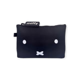 Crafted from premium silicone, the Miffy Bunny Case Black - 14cm showcases a minimalist design with a cartoon face featuring two white eyes and a small "x" for the mouth. The tab prominently displays the brand name "Miffy," encapsulating the essence of the Miffy bunny face in every detail.