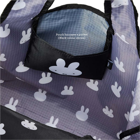 Close-up of a Miffy Black Reusable Shopping Bag, featuring white bunny patterns. This lightweight tote is both compact and practical, with an inside flap labeled "Pouch becomes a pocket.