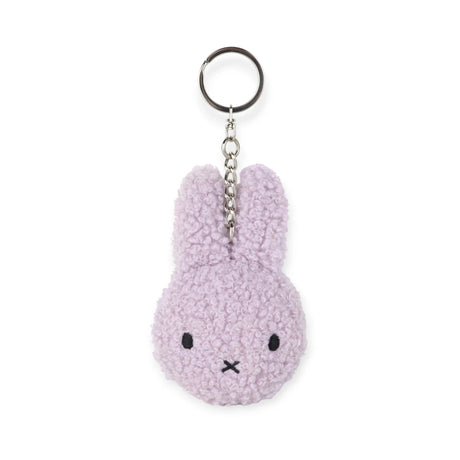 The Miffy Keychain Tiny Teddy Plush - Terry is a purple, eco-friendly keychain featuring a simple embroidered face and metal ring to keep your keys secure, offering charm and utility in one.