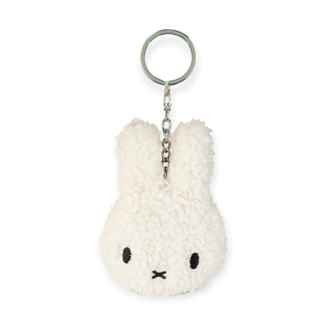 The Miffy Keychain Terry Plush - Cream features a white plush rabbit head with long ears and a simple face, attached to a metal keyring. This eco-friendly accessory by Miffy adds charm to any collection.