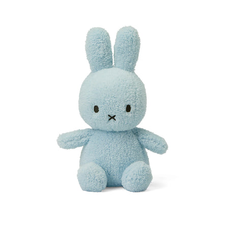 Discover the comfort of the Miffy Bunny Plush - Terry Light Blue 23cm by Miffy, crafted with soft terry fabric and adorned with black eyes. Its simplicity leaves a lasting impression, featuring a small cross-shaped mouth that highlights its eco-friendly design. A delightful addition to any collection!