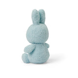 The Miffy Bunny Plush - Terry Light Blue 23cm by Miffy is elegantly displayed against a plain white background, highlighting its peaceful light blue shade in soft terry fabric.