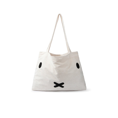 Miffy Corduroy Shopper Bag by Miffy, an eco-friendly white tote with long handles, showcases a minimalist black rabbit face design.