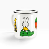 White ceramic mug with rabbit in a green sweater and parrot print, black rim