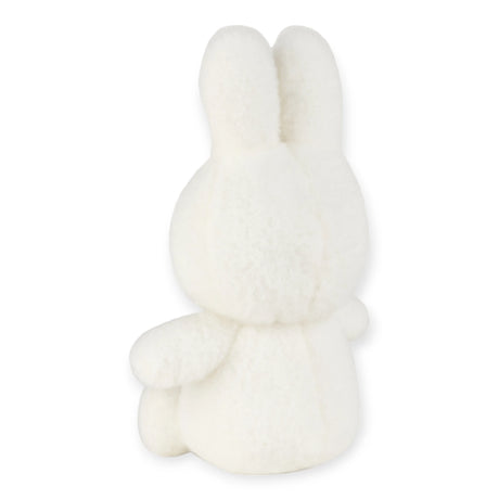 The Miffy Plush Cotton Candy - Cream 23cm, a charming Miffy plush bunny made from ultra-soft fabric, is seen sitting upright on a plain background, showcasing its back view.