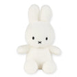 Sitting upright against a plain backdrop, the Miffy Plush Cotton Candy in Cream from the Miffy brand features long ears and a simple facial expression, crafted from ultra-soft fabric for a cozy feel. Measuring 23cm, this plush offers both comfort and charm.