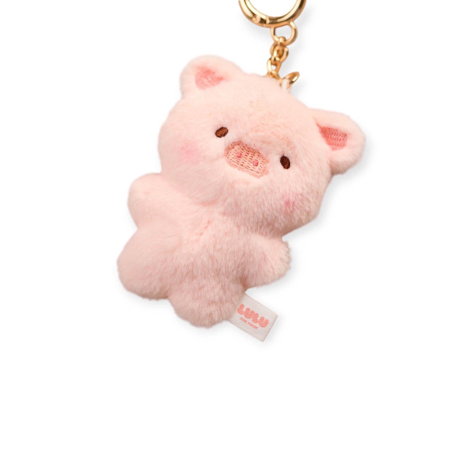 The Mini LuLu Keychain by LuLu The Piggy features a plush pink LuLu the Piggy design, gold clasp, and a small fabric tag on its side.
