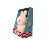 The Mini Miffy Plush - Pink Lucky Charm, presented in a green box with an appealing checkered red and white base, makes for a perfect gift. The packaging highlights "100% recycled filling," emphasizing the eco-friendly nature of this delightful product from the Miffy brand.