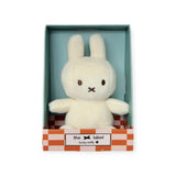 The Mini Miffy Plush - Cream Lucky Charm from Miffy, nestled in a checkered box, makes for the perfect gift.