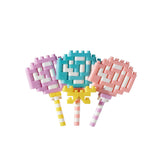 The Nanoblock Lollipop by Nanoblock features three colorful candies crafted from interlocking toy bricks, creating a vibrant addition to the Food Series. With pink, blue, and purple patterns on striped sticks, these nanoblock-inspired treats bring a playful twist to your collection of miniature building delights.