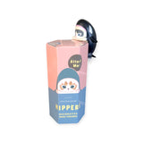 A small penguin figure perches on a hexagonal Blind Box labeled "Mofusand Hippers Blind Box" by Mofusand, featuring a cartoon animal illustration and the text "Attach Me!" inviting you to explore the sea-themed characters inside.