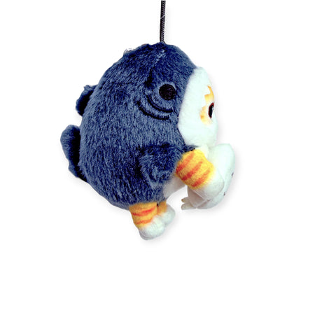 A small Mofusand Shark Nyan plush bag charm, featuring a cute blue penguin design with yellow-striped feet, white belly, and hanging loop on top, by Mofusand, shown against a white background.