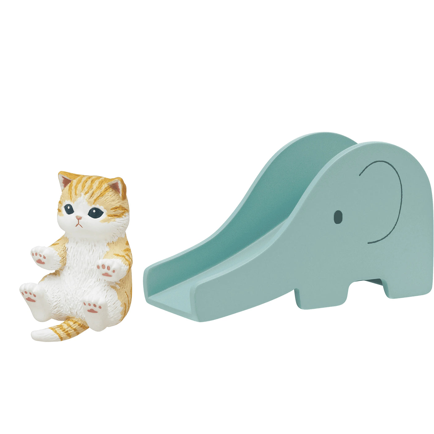 A mini cat figure playfully sits beside a blue slide shaped like an elephant, capturing the whimsical charm of the Mofusand Premium Blind Box - Cats on Slides collectibles.