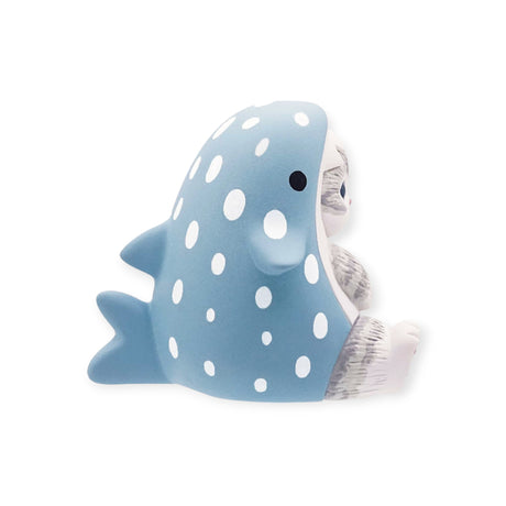 A small toy sloth sits adorably, dressed in a blue, polka-dotted sea creature costume with fins and a tail, reminiscent of the Mofusand Premium - Aquarium Cat Blind Box. Perfect for collectors, this charming piece could be your next surprise find from Mofusand.