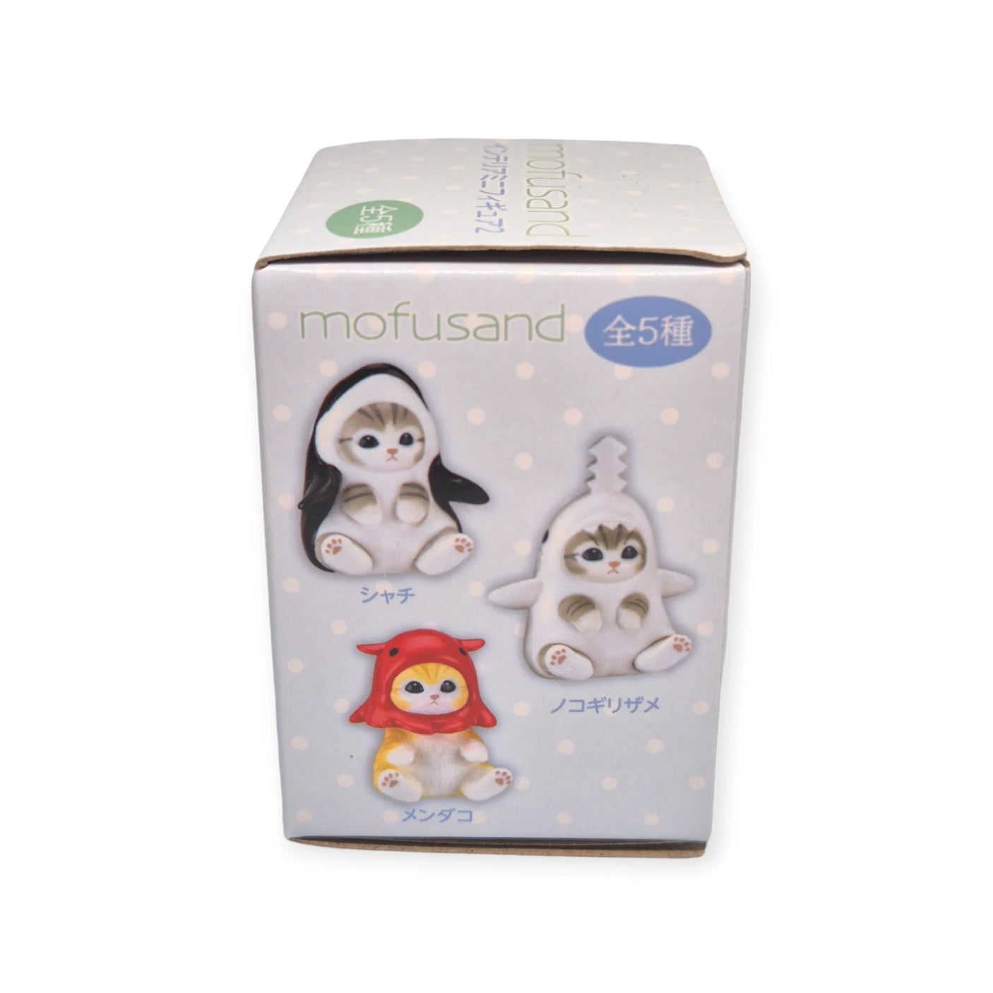 The Mofusand Mini Figure Blind Box - Vol 2 (Blue) offers three charming cat figures adorned in sea creature costumes set against a whimsical polka dot background.