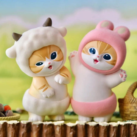 Pair of plush animal blind box figures: white cat in hood and pink cat-hood figure