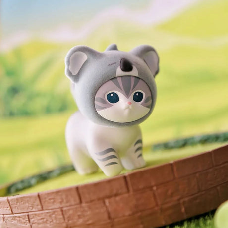 Gray plush cat-hood animal blind box figure with large blue eyes and striped markings