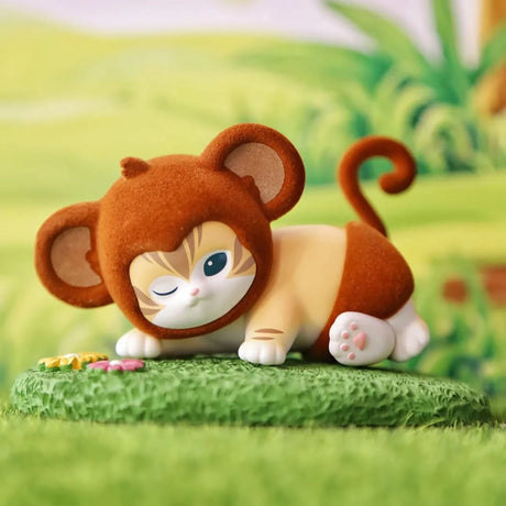 Brown plush animal blind box figure on green base with curled tail and closed eyes