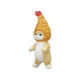 The Mofusand Premium - Fried Shrimp Cat Blind Box figurine showcases a whimsical cat adorned with a fried chicken drumstick as a hat, standing upright. As part of the Mofusand collection, it effortlessly merges humorous design with the endearing idea of a cat's favorite food, making it a delightful addition for fans.