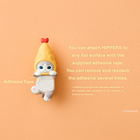 Yellow shrimp-shaped Hippers figurine shown with adhesive tape label
