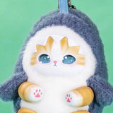 Close-up dark blue hooded kitten keychain plush with sparkling blue eyes and tan paw details